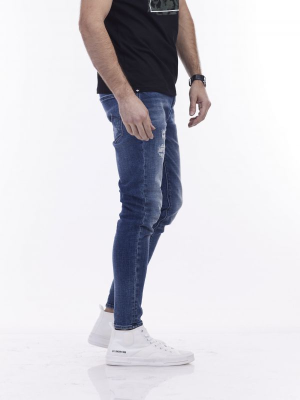 סקיני ג’ינס כחול משופשף עם קרעים