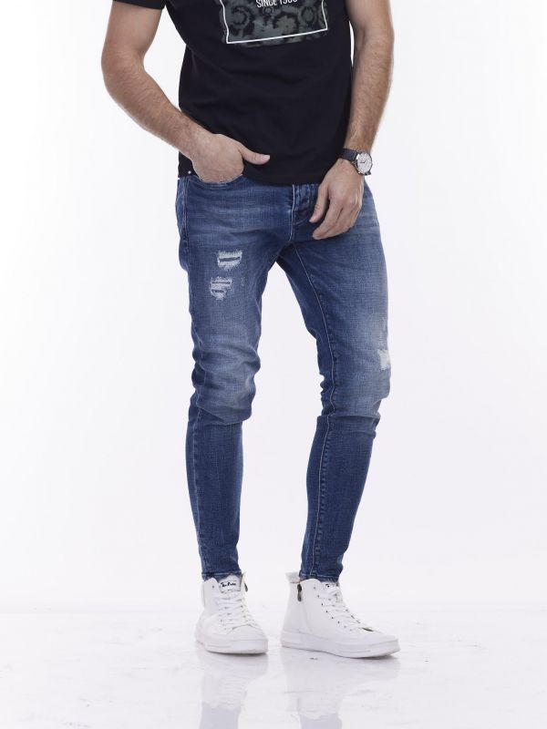 סקיני ג’ינס כחול משופשף עם קרעים