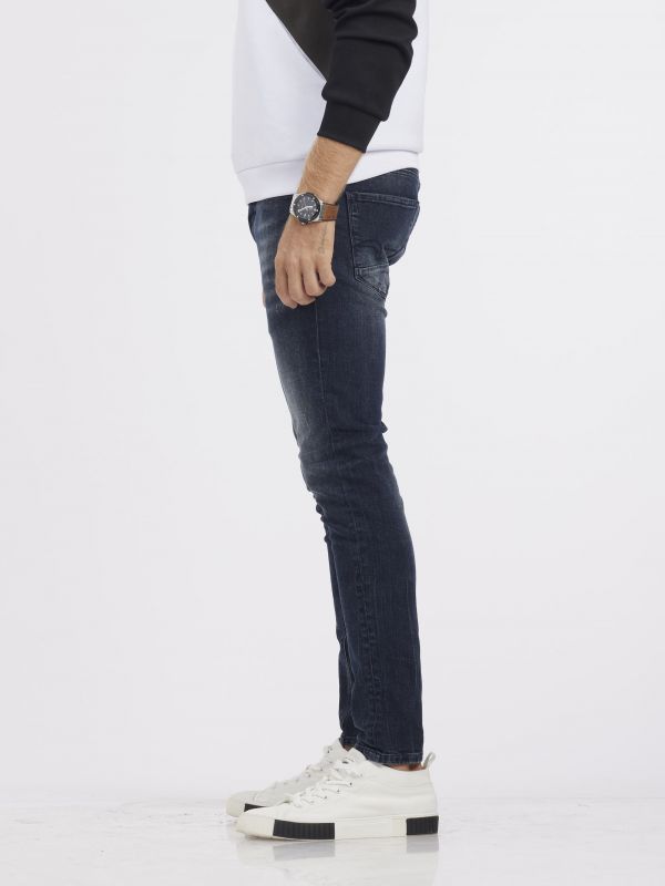 מכנסי ג’ינס MARTIN גזרת סקיני בגוון כחול נייבי משופשף