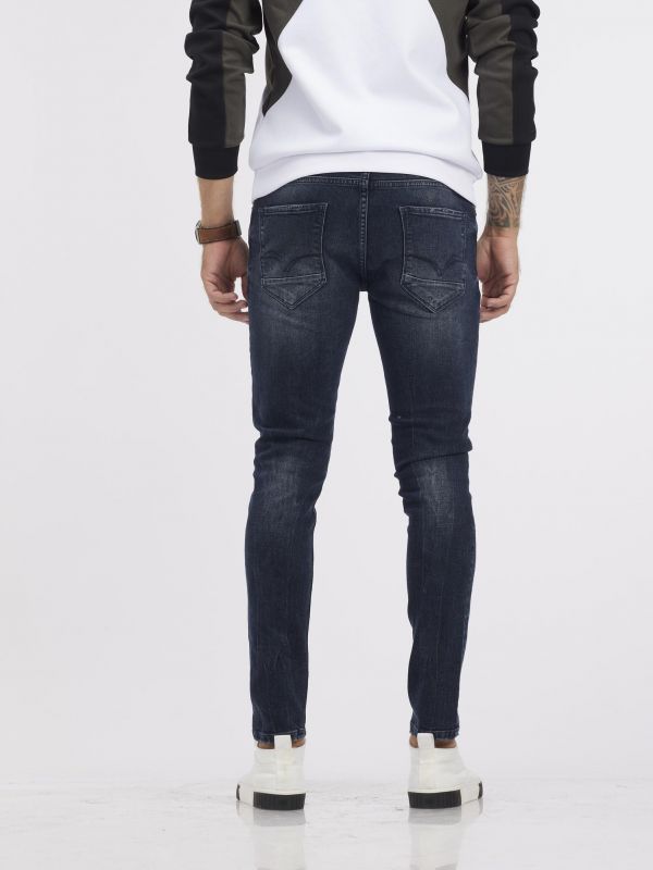 מכנסי ג’ינס MARTIN גזרת סקיני בגוון כחול נייבי משופשף