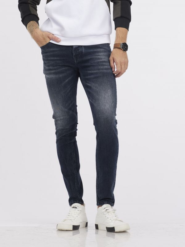 מכנסי ג’ינס MARTIN גזרת סקיני בגוון כחול נייבי משופשף