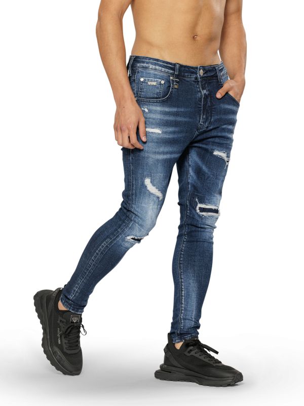 מכנסי ג’ינס COLIN סקיני בצבע כחול עם קרעים לגברים
