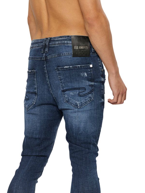 מכנסי ג’ינס COLIN סקיני בצבע כחול עם קרעים לגברים