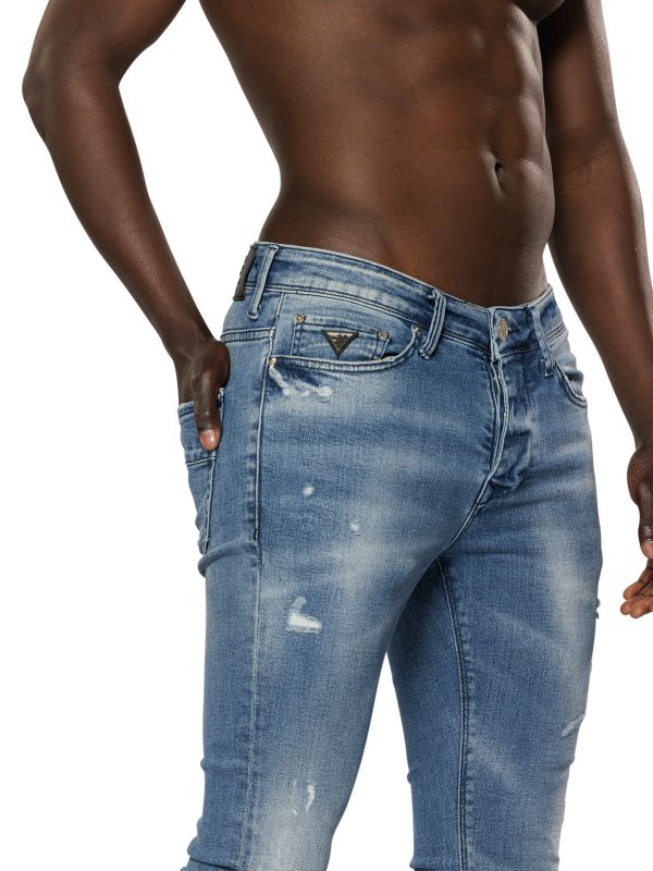 מכנסי ג’ינס סקיני בצבע כחול בהיר משופשף עם קרעים לגברים