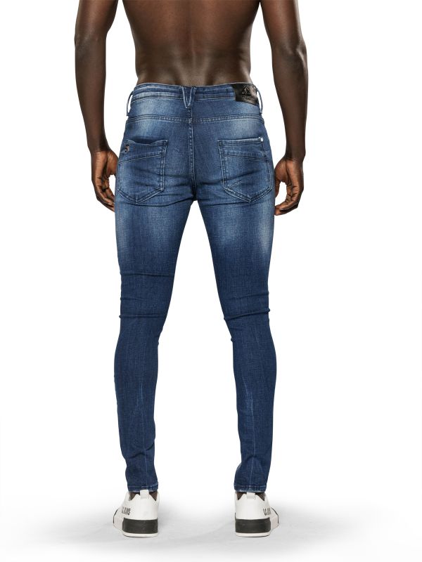 מכנסי ג’ינס סקיני בצבע כחול משופשף עם קרעים לגברים