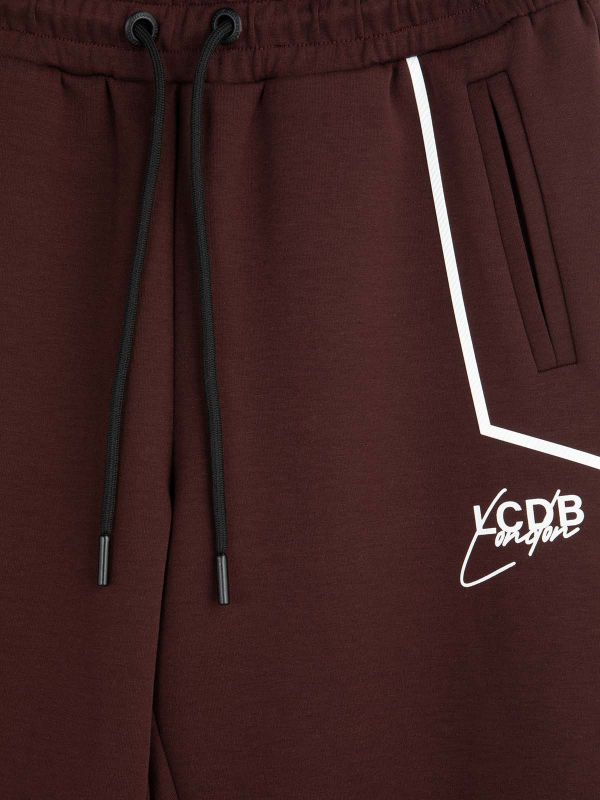 מכנסי טרנינג עם רוכסנים בנים