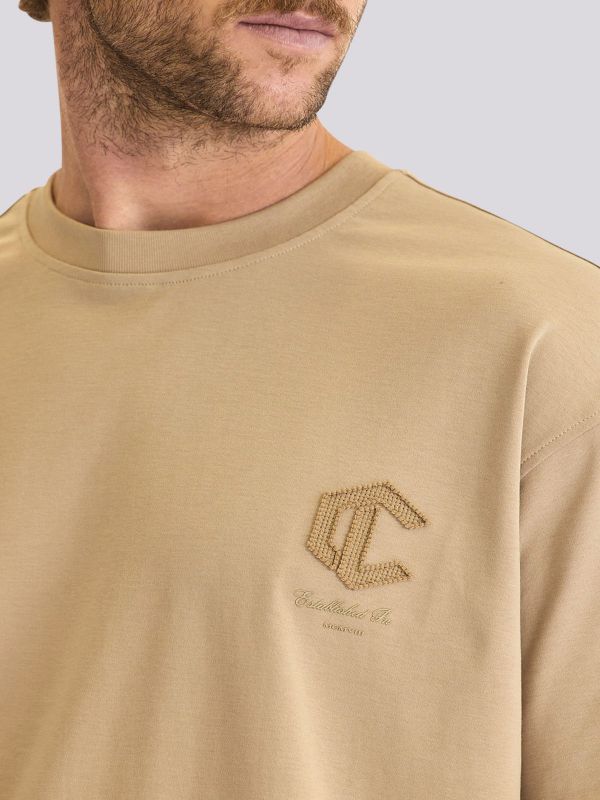 חולצת טי-שרט אוברסייז עם הדפסי מותג בולטים לגברים